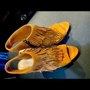 Add a little sass to your outfit with these fun-fringed sandals